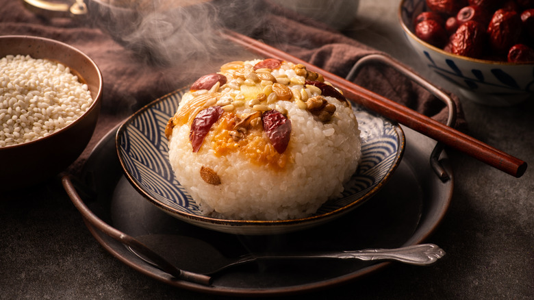 eight treasure rice with chopsticks