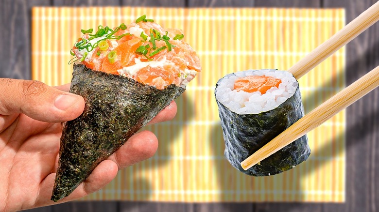 hand and chopsticks holding sushi