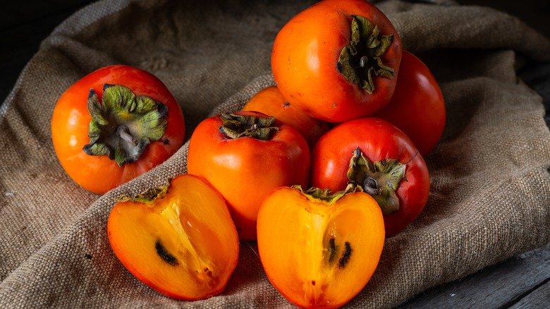 Persimmons on table cloth