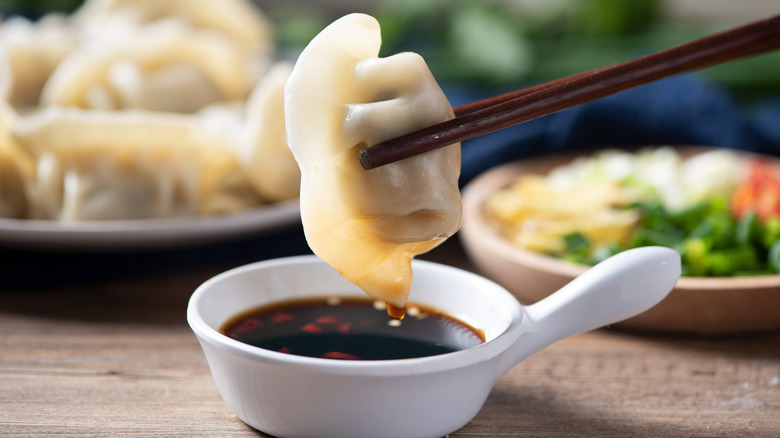 Dumpling dipped in soy sauce