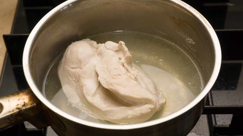 Chicken boiling on stove