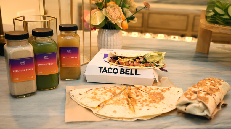 Taco Bell taco, burrito, and quesadilla on a table