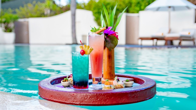 tropical cocktails on floating tray