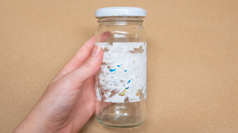 Glass jar with a stuck label