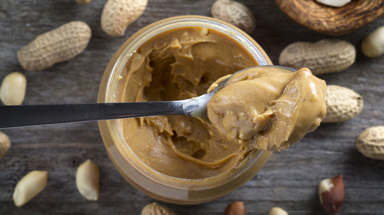 inside of a peanut butter jar with spoonful