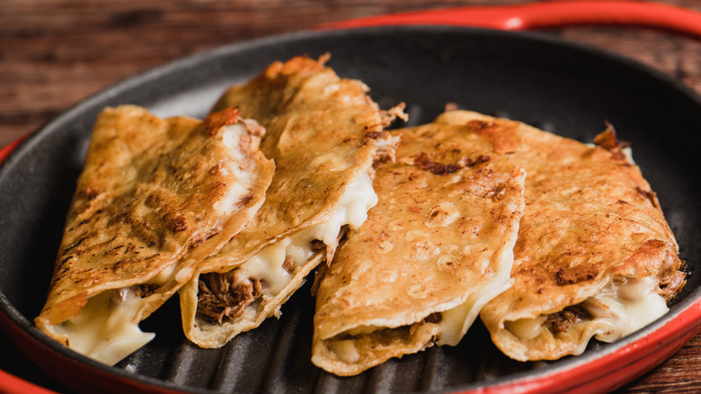 Quesabirria tacos on a skillet