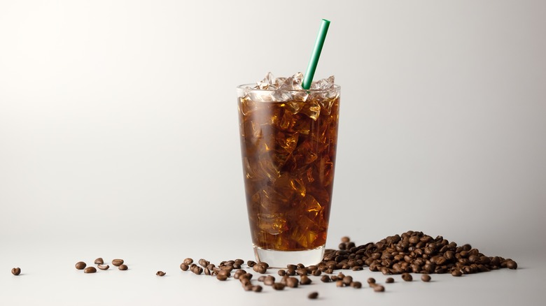 iced black coffee with green straw