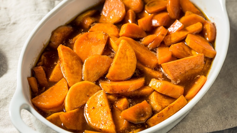 classic candied yams in a white porcelain dish
