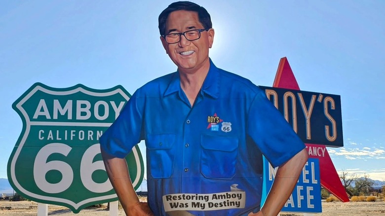 Mural of Albert Okura, founder of Juan Pollo, on the side of the road