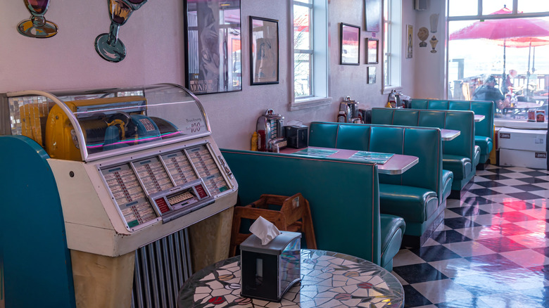 old soda shop with green booths and juke box