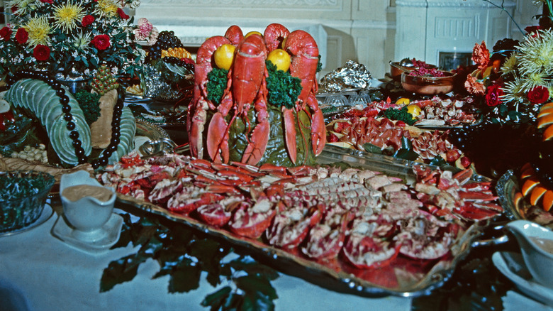A vintage party buffet spread with lobsters and other inscrutable delicacies