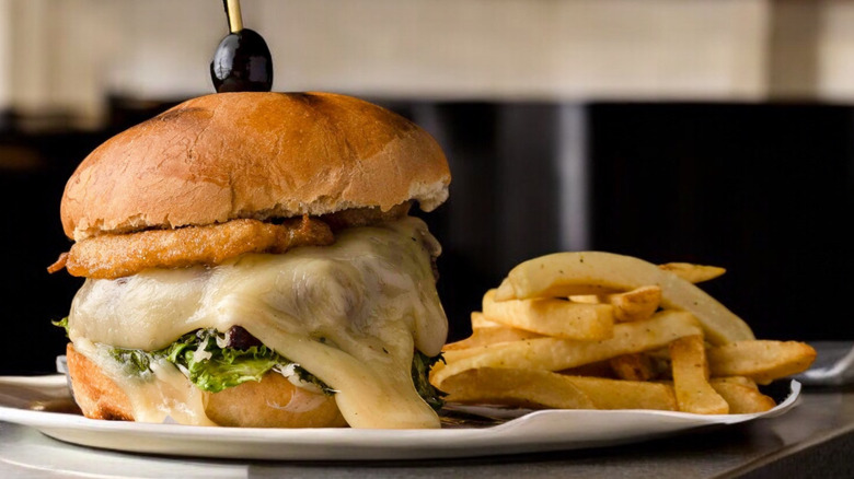 Manchego cheeseburger with a side of fries