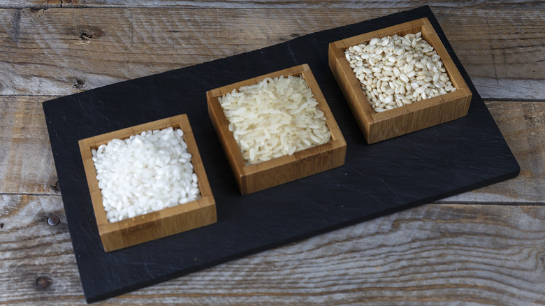 Various types of rice in wooden bowls
