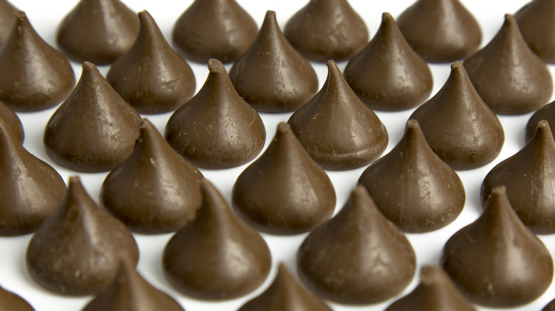 unwrapped Hershey's kisses lined up in rows