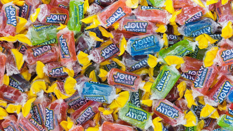 a pile of individually wrapped colorful jolly rancher candies