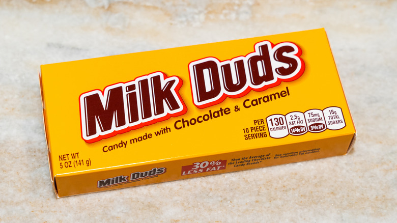 a yellow carton of milk duds