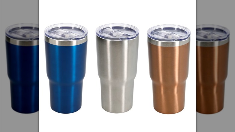 three stainless steel tumbles in blue, silver, and copper