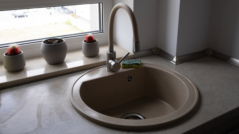 Beige composite round kitchen sink