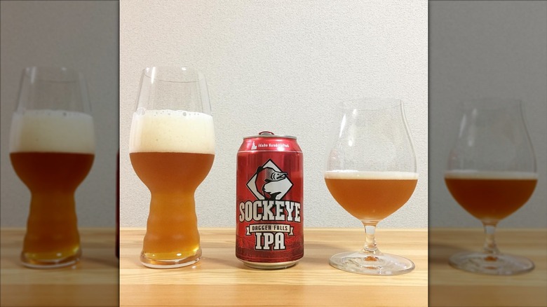 Two glasses flanking a red can of Daggers Fall IPA