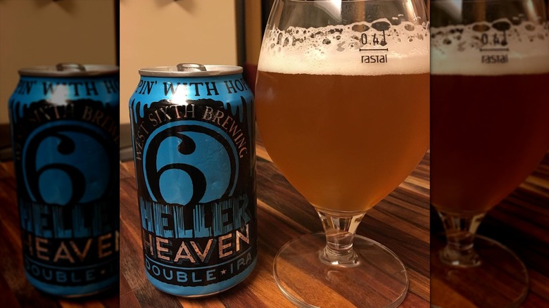 A blue can of Heller Heaven IPA next to a filled beer glass