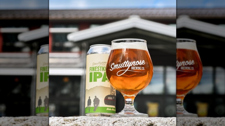 Can of Finestkind IPA behind a glass of beer.