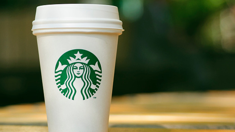 A Starbucks cup on a table