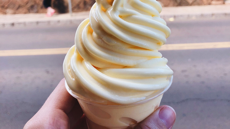 hand holding dole whip cup