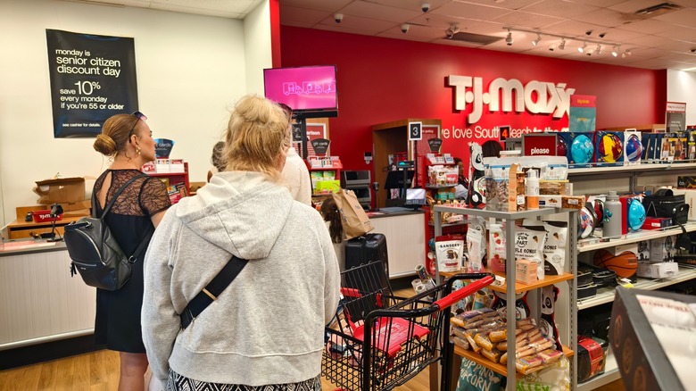 Customers waiting in line at a T.J. Maxx store