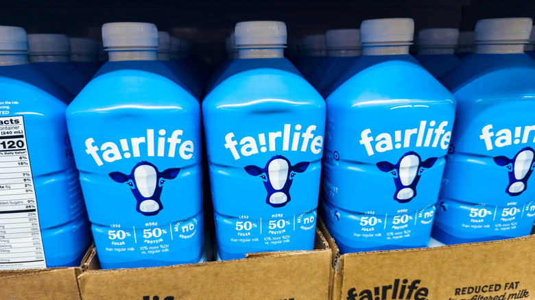 Fairlife ultra-filtered milk stacked on a shelf at a market