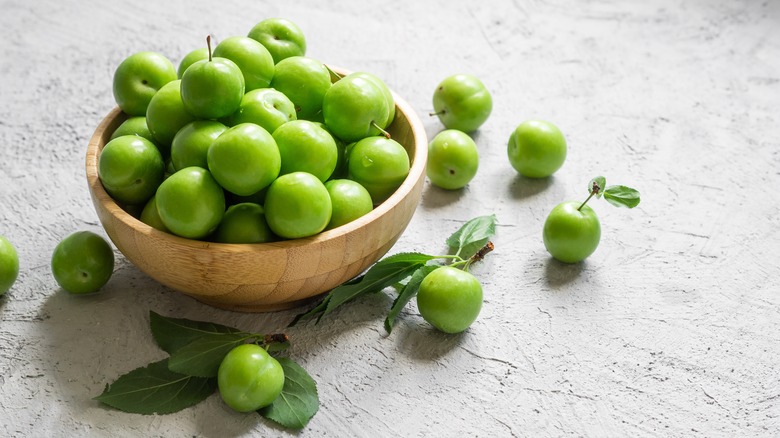 small green plums in bowl
