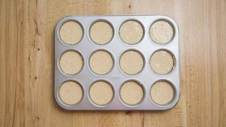 unbaked muffin batter in tin