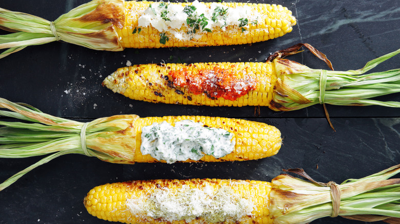 Four grilled corn on cobs