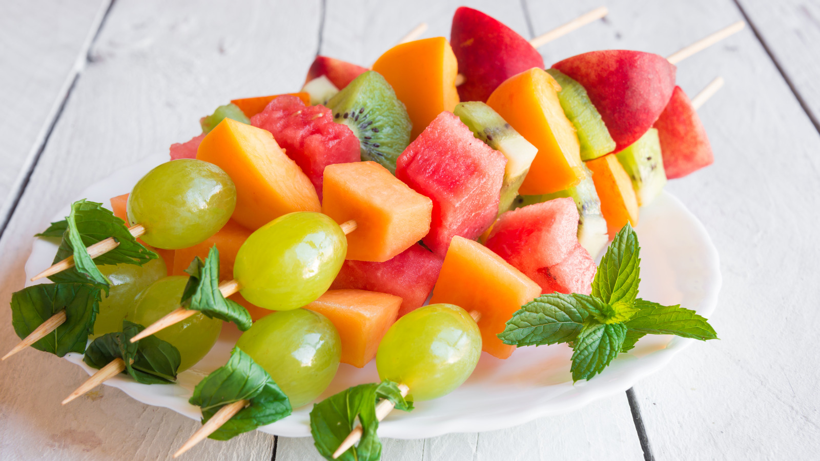 The Sweet And Spicy Ingredient You Need To Drizzle On Fruit Kebabs