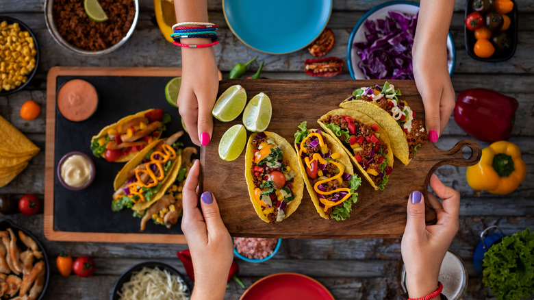 assortment of tacos with Mexican foods