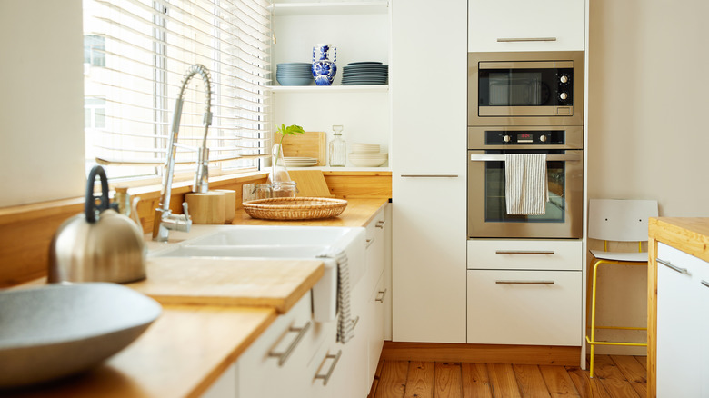 Kitchen with oven, microwave and sink