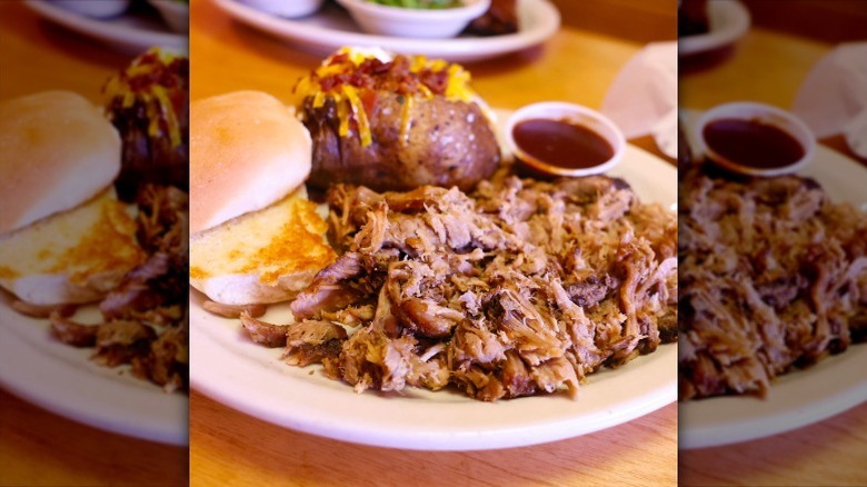 Pulled pork served on a plate with sides at Texas Roadhouse