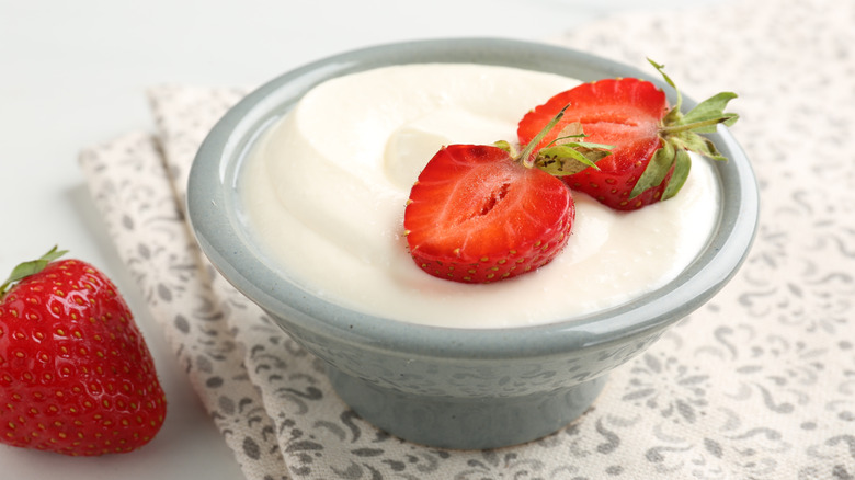 Strawberries in dish with white liquid