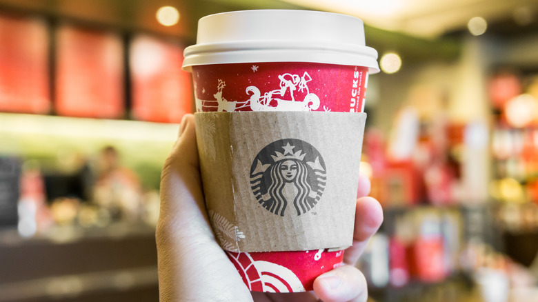 starbucks' coffee cup with holiday design 