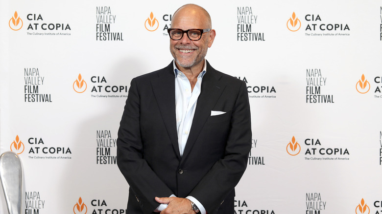 Alton Brown smiling for the press