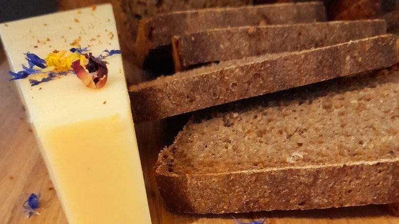 Estonian cheese with rye bread and flower petals
