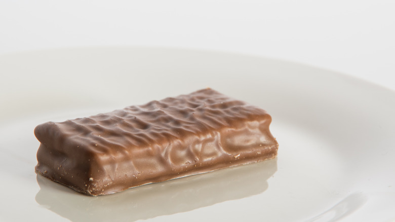 Tim Tam cookie on white plate