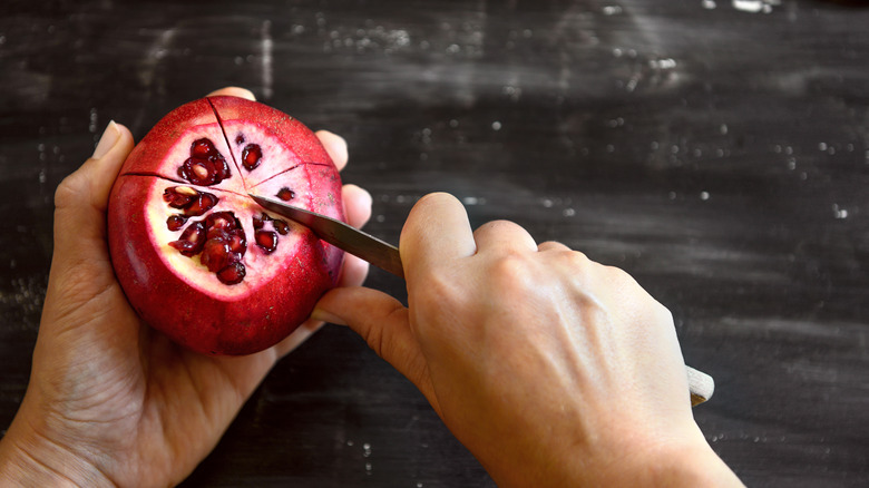 Cutting a pomegranate 