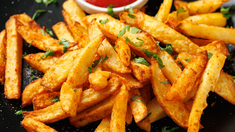Crispy homemade french fries with ketchup