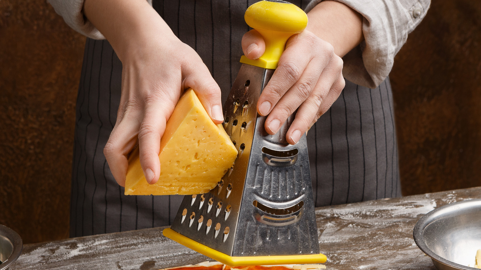 The Trick To Cleaning Your Cheese Grater With A Lemon
