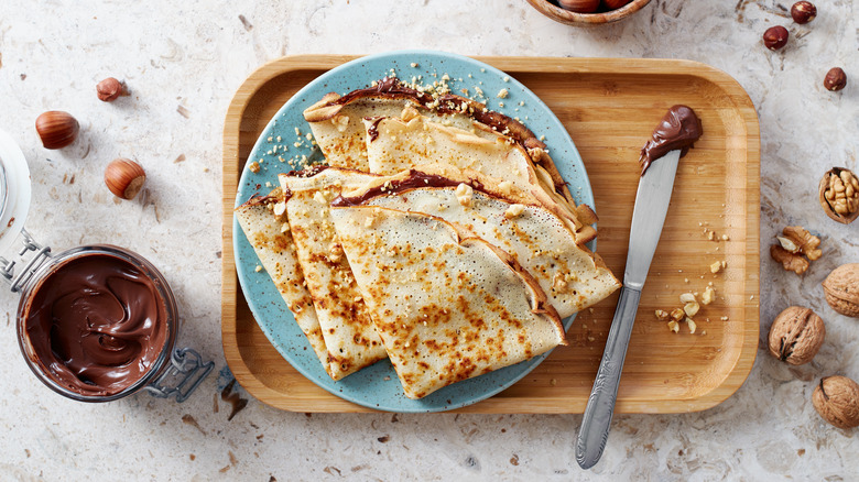 nutella crepes on cutting board