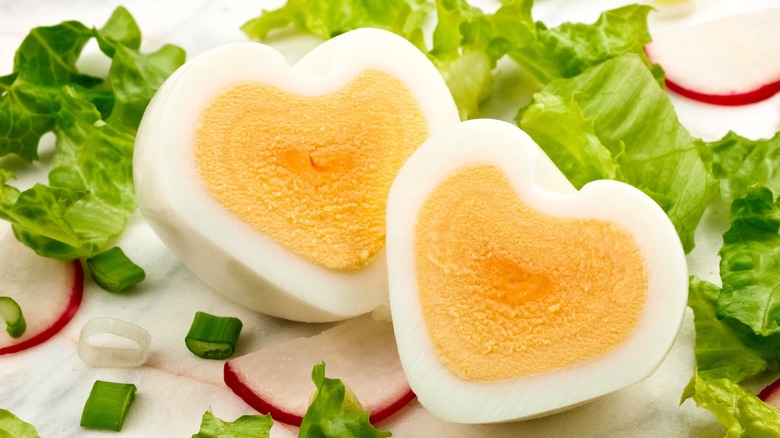 Heart-shaped eggs with lettuce
