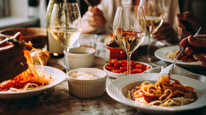 plates of pasta and wine in italy