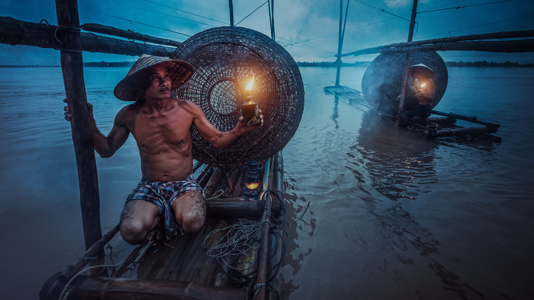 fishermen on mekong river