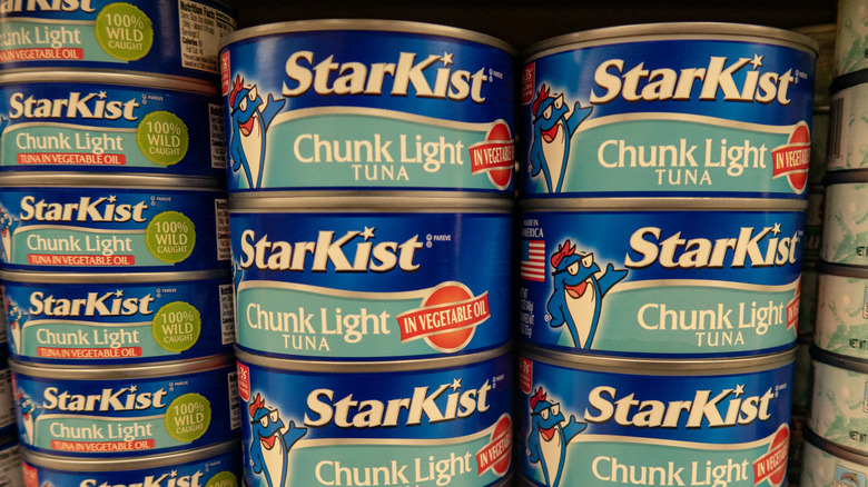 cans of Starkist on grocery shelf 