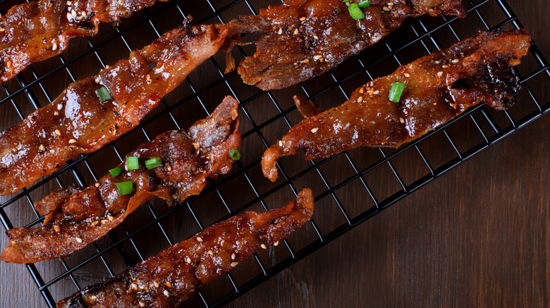 Baked strips of bacon with a glaze